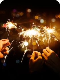 Guests celebrating with sparklers at night