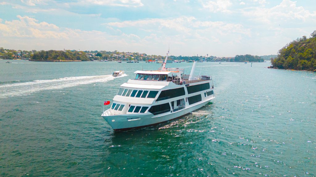 Luxury yacht sailing on calm harbour waters