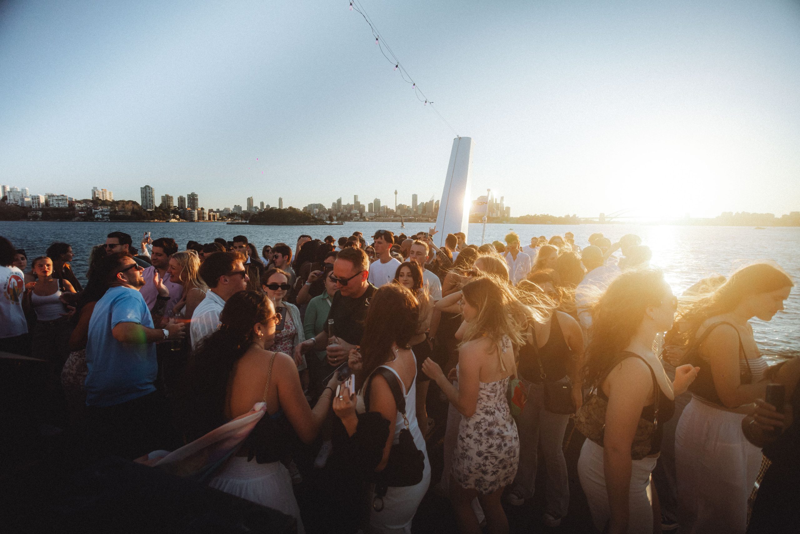 Guests enjoying sunset views during a harbour cruise