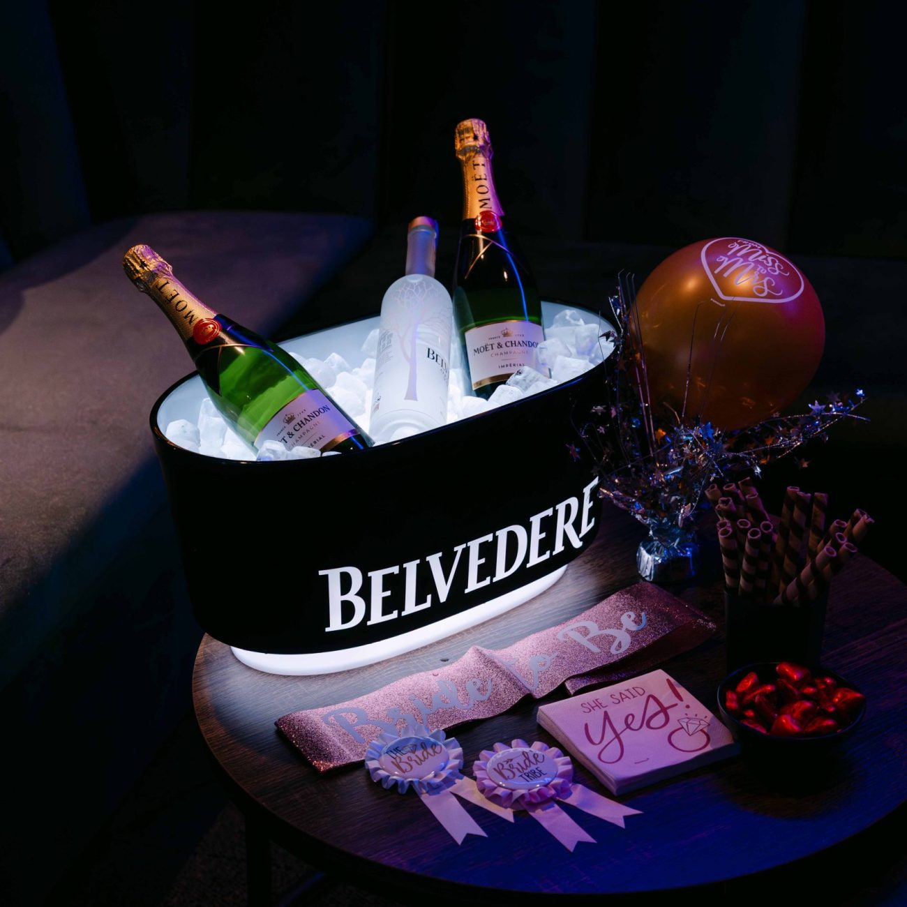 Belvedere drinks setup with ambient blue lighting